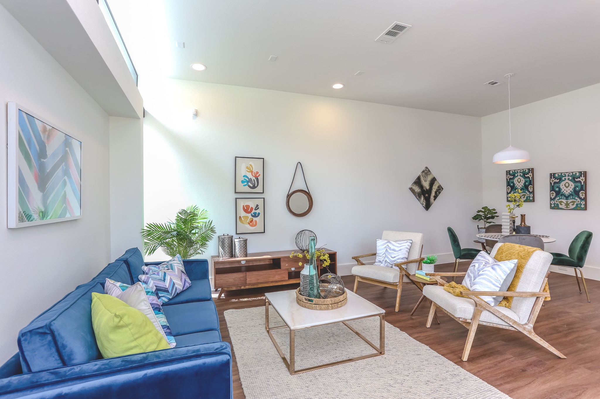 The chic living room features recessed lighting and is pre-wired for surround sounds, cable television, and internet.