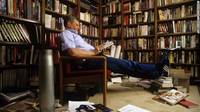Tom Clancy in his home library.