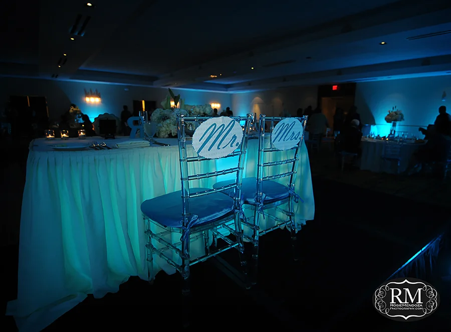 Reception setup featuring Mr. and Mrs. chair signs