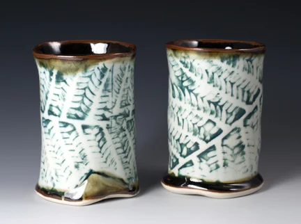 Porcelain cups with Fern Design, fired in a gas kiln. 