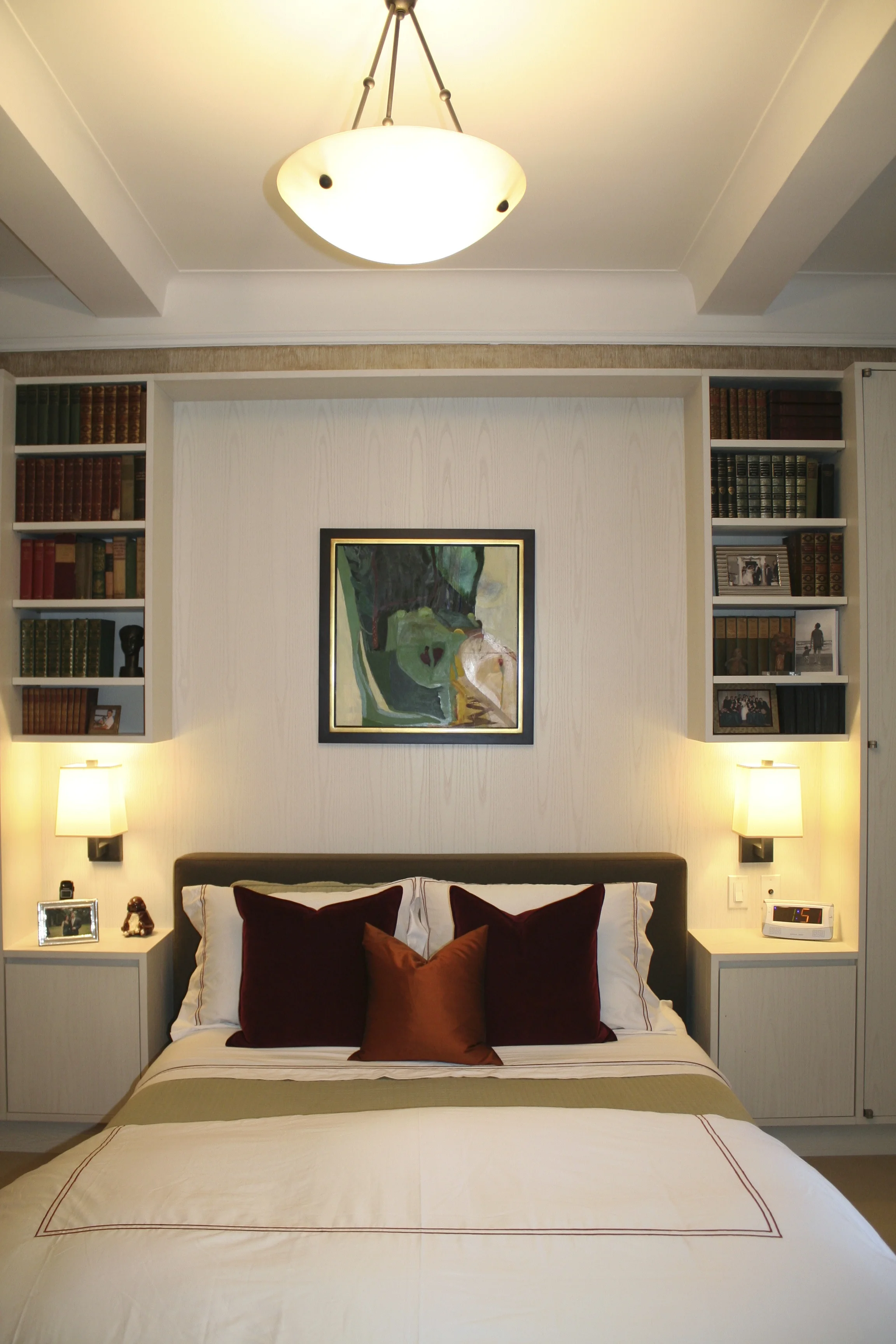 One 60W Cree LED bulb in each of the bedside lamps and three 75W Cree LED bulbs in the overhead fixture