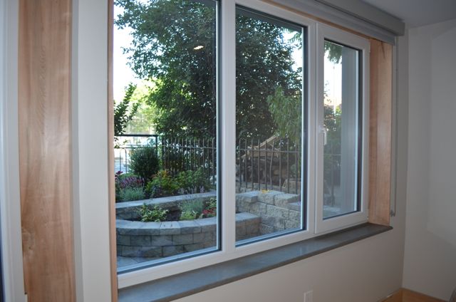 Triple pane Schuco windows provide insulation and muffle street noise in this urban row house built to Passive House standards
