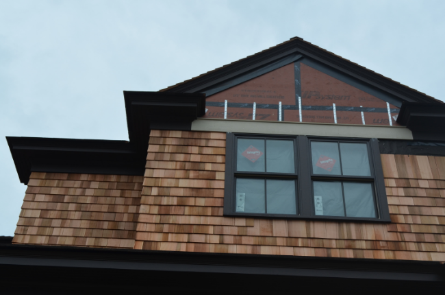 Partial installation of Sunset Green Home's Certi-grade Western Red Cedar shingles from Liberty Cedar
