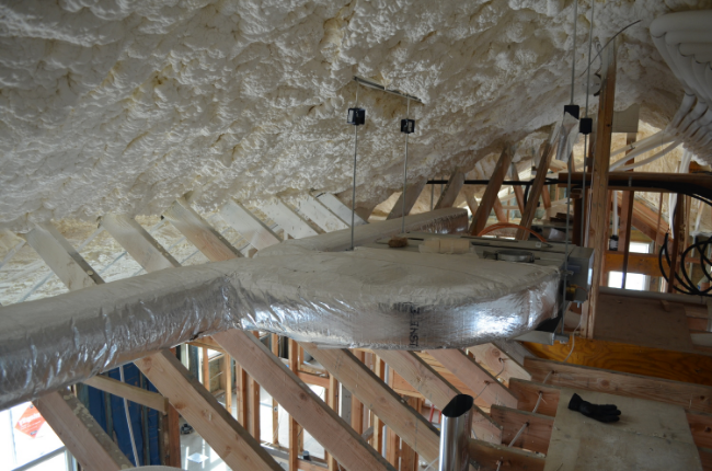 Air handler in the background with short duct runs to serve the bedrooms below.