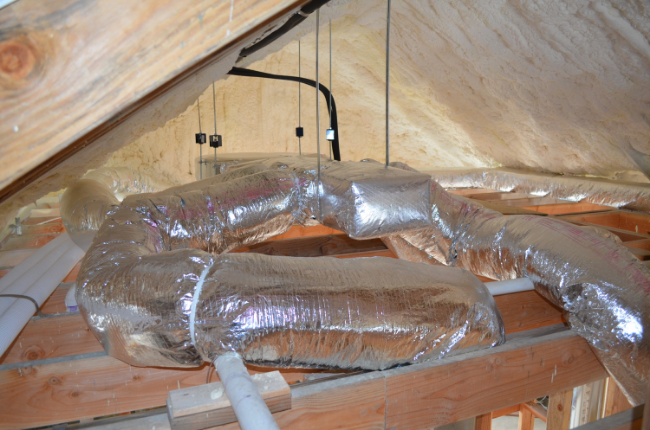 Air handler and ducts located in the conditioned attic space.