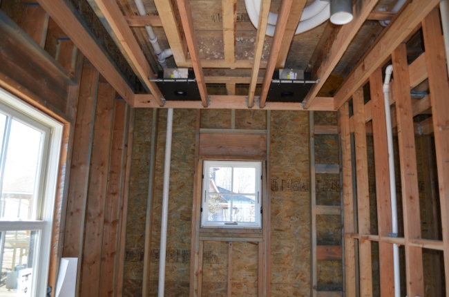 Two round wet-rated recessed fixtures for the guest room shower