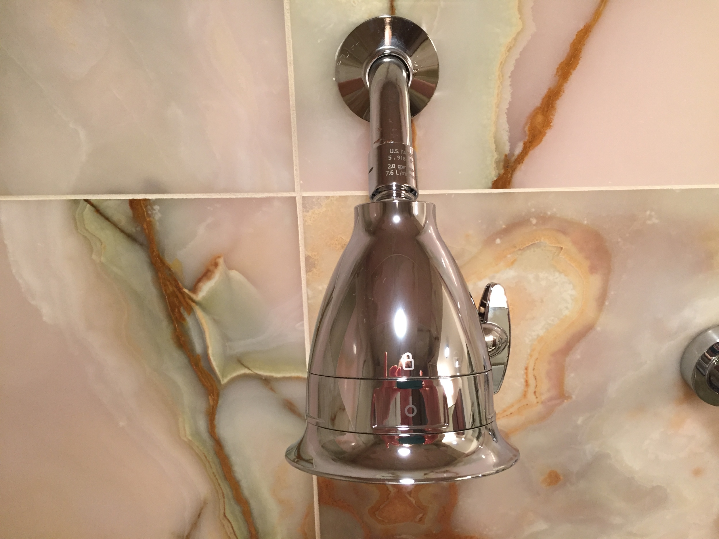Install the new shower head by twisting clockwise