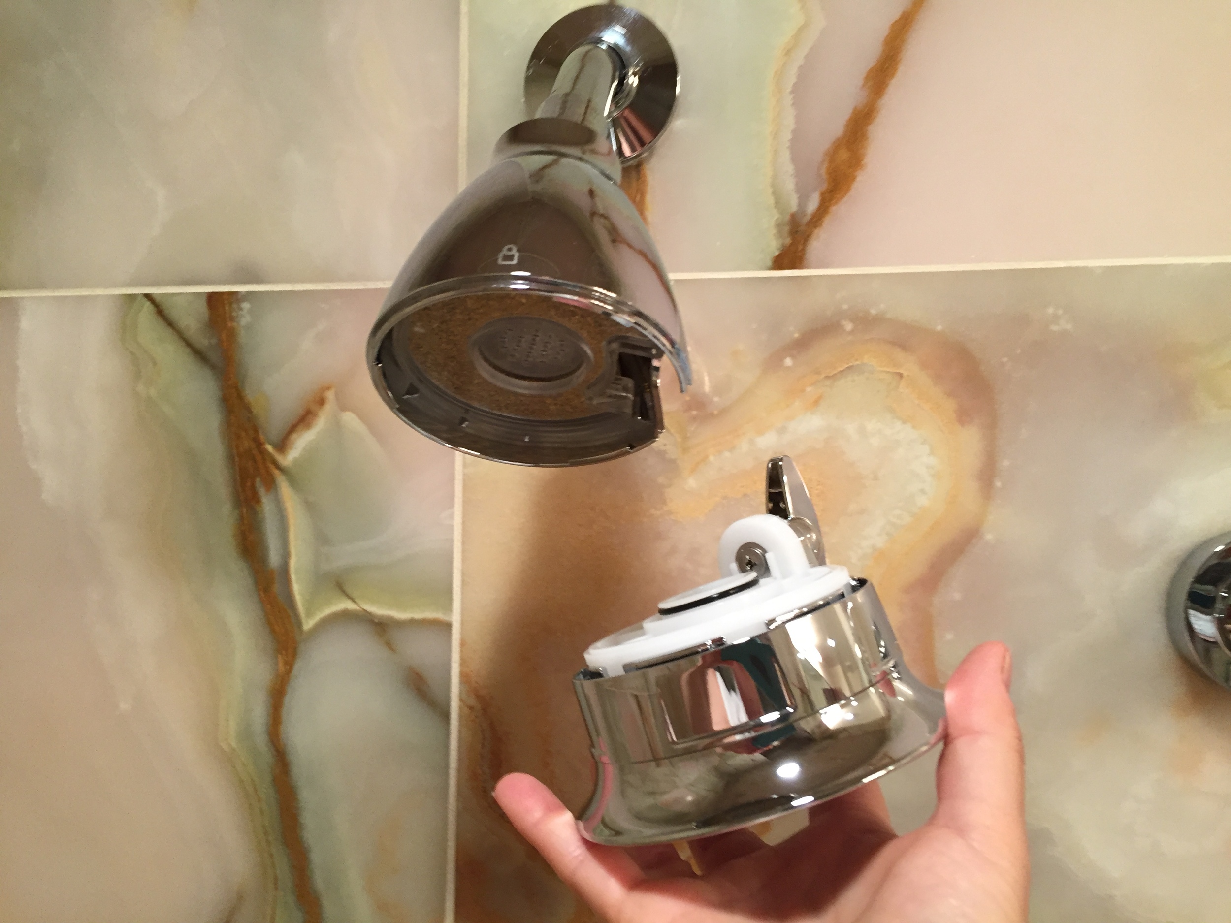 Unlock the bottom section on Speakman's Hotel Pure shower head to remove and replace the filter cartridge