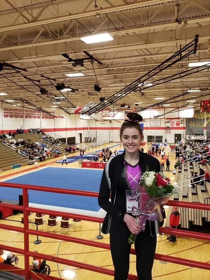 Navin pushes past injury through state gymnastics competition