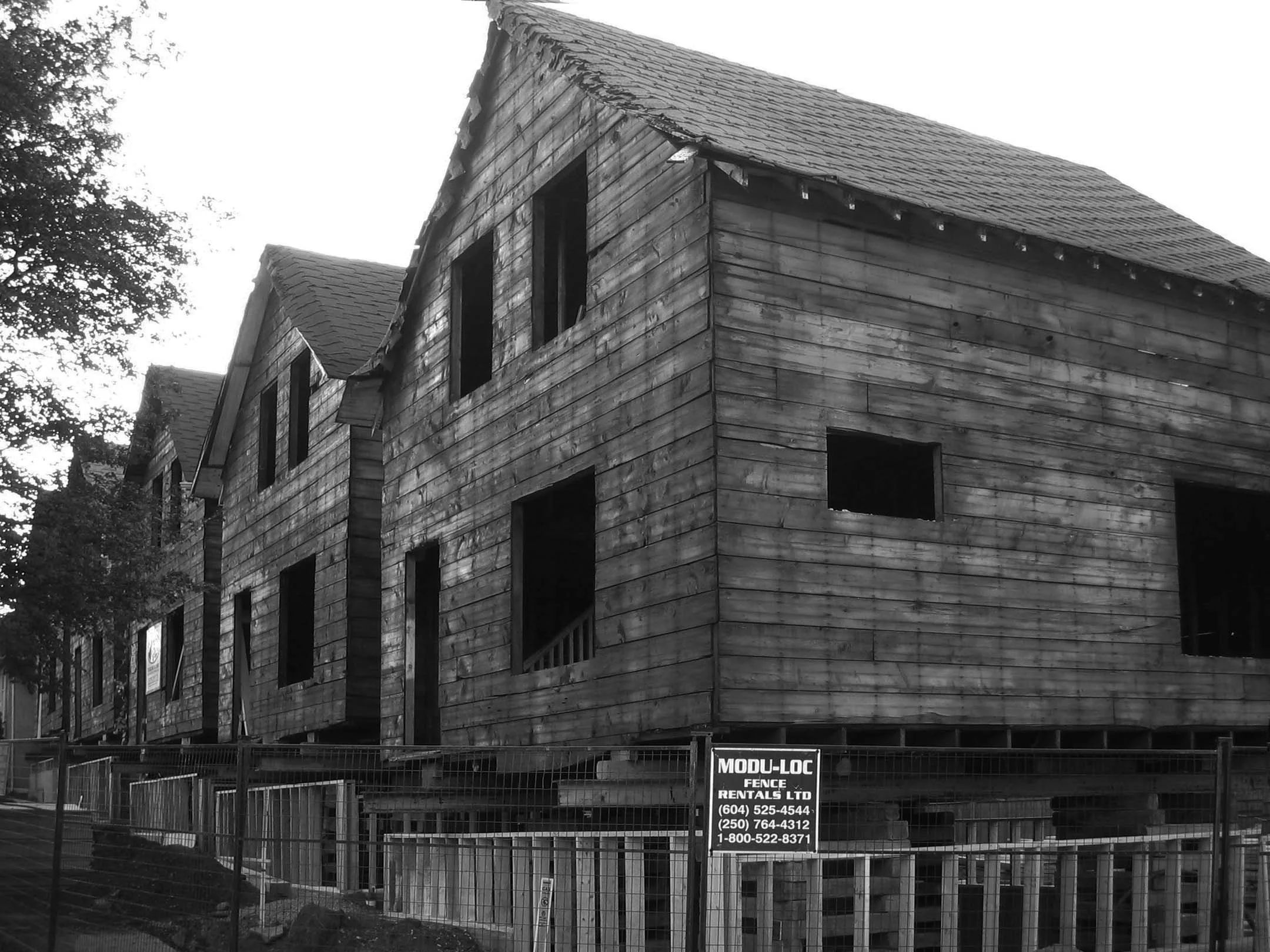 Five houses stripped down to sheathing