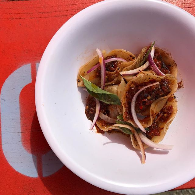 Meat that's brined for 2 days... then slow-braised for 6 hours. The only thing fast about these Cumin Lamb Dumplings, (with spicy House-Made Sambal, tangy Black Vinegar, and fresh Thai Basil), is how quickly you'll eat them. Now serving at 👉 @backba