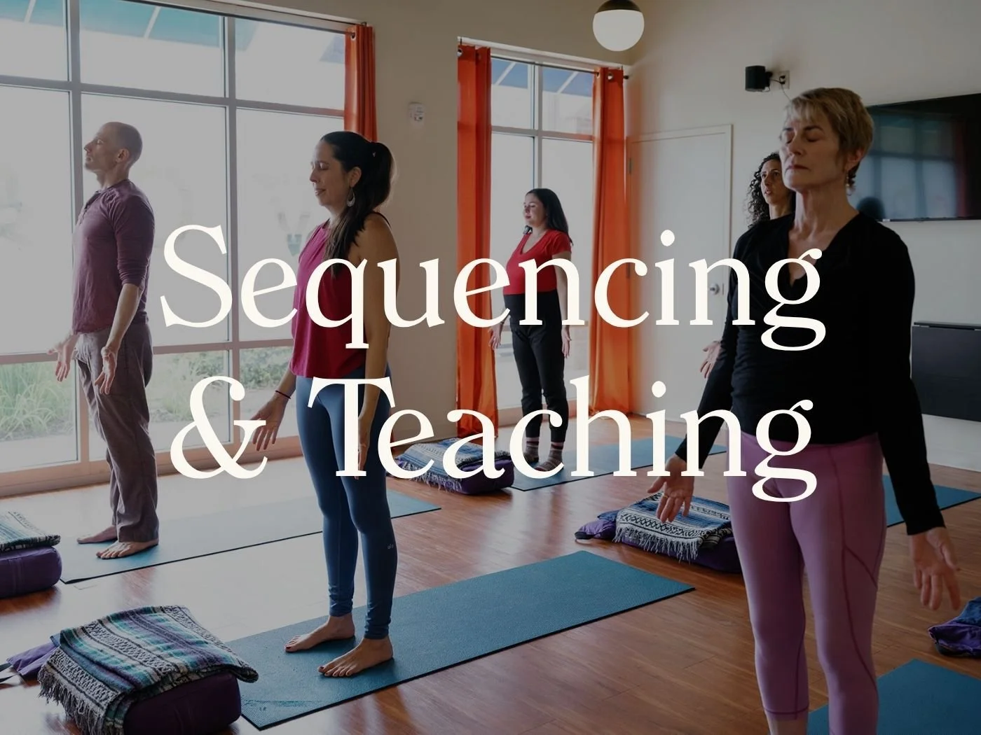 Yoga teacher guiding intentional sequencing and teaching in a yoga class