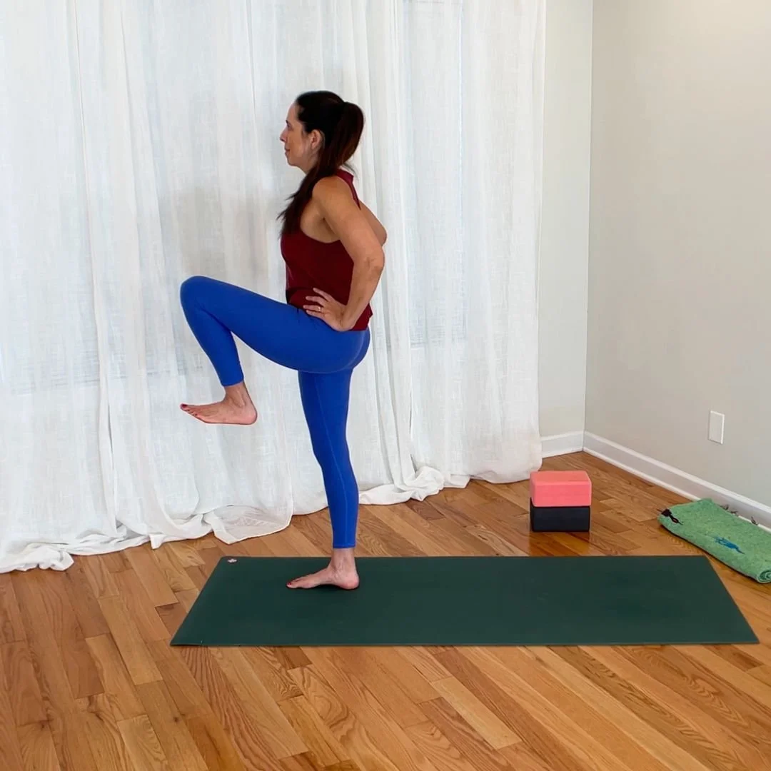Woman demonstrating hip flexion by bringing thigh toward pelvis