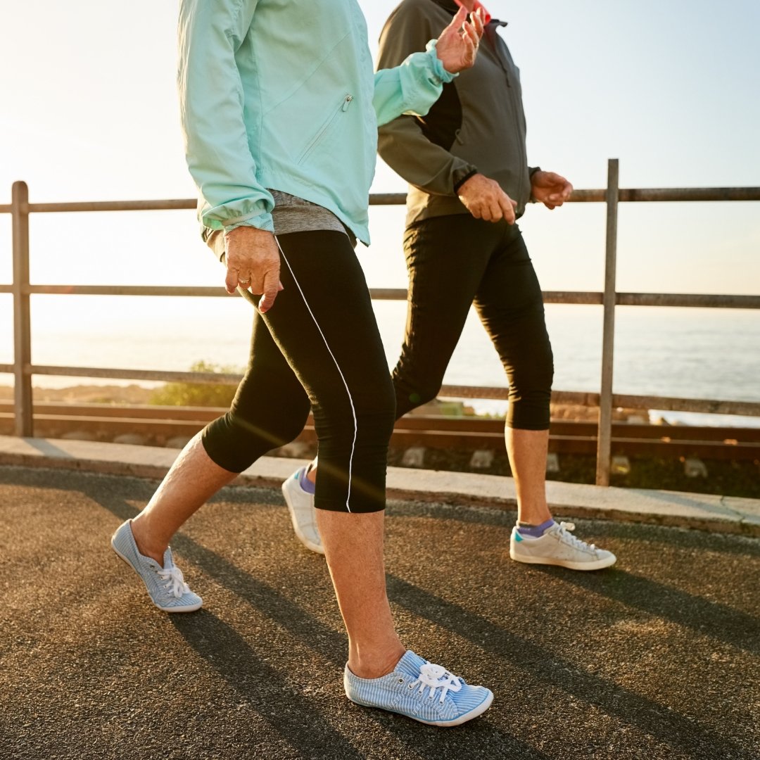 People walking outdoors as a general warm-up before physical activity.