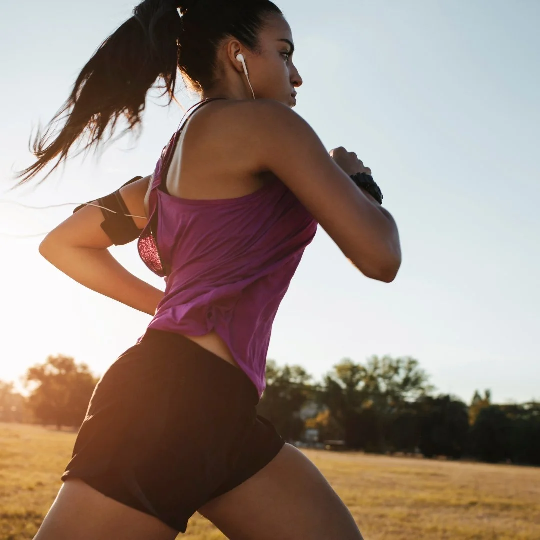 Runner jogging outdoors as an active warm-up before exercise.