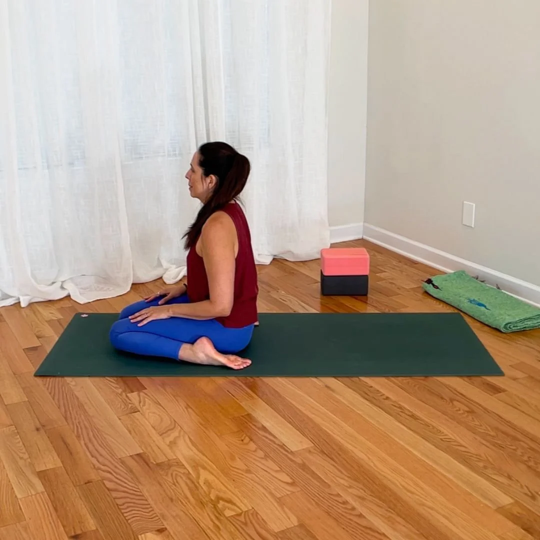 Upright virasana hero pose with deeply bent knees and upright torso