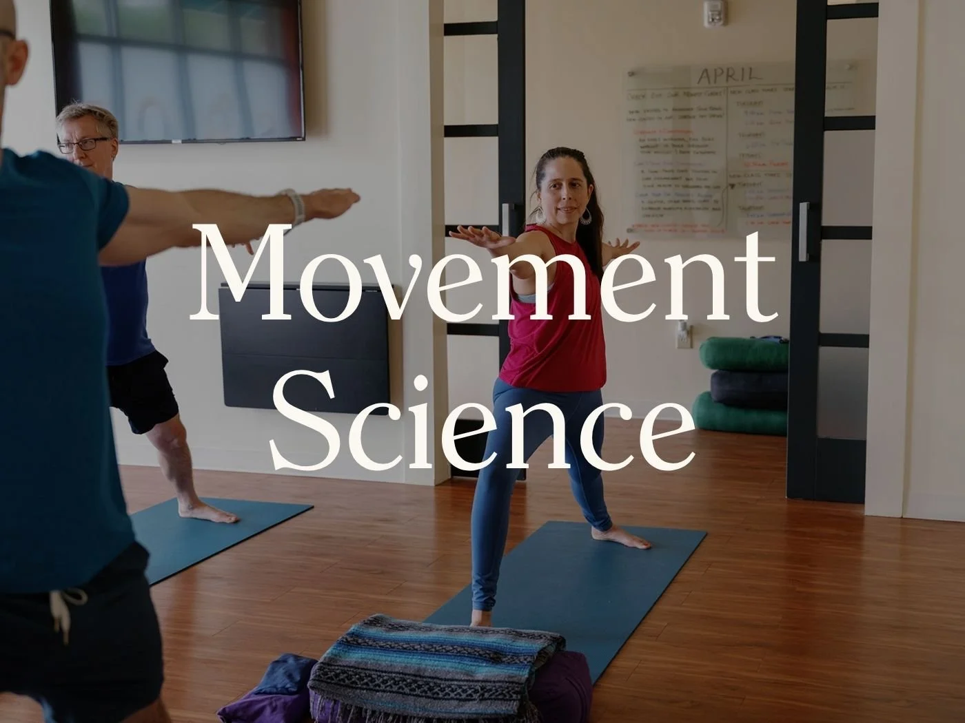 Yoga teacher demonstrating evidence-based movement and biomechanics concepts