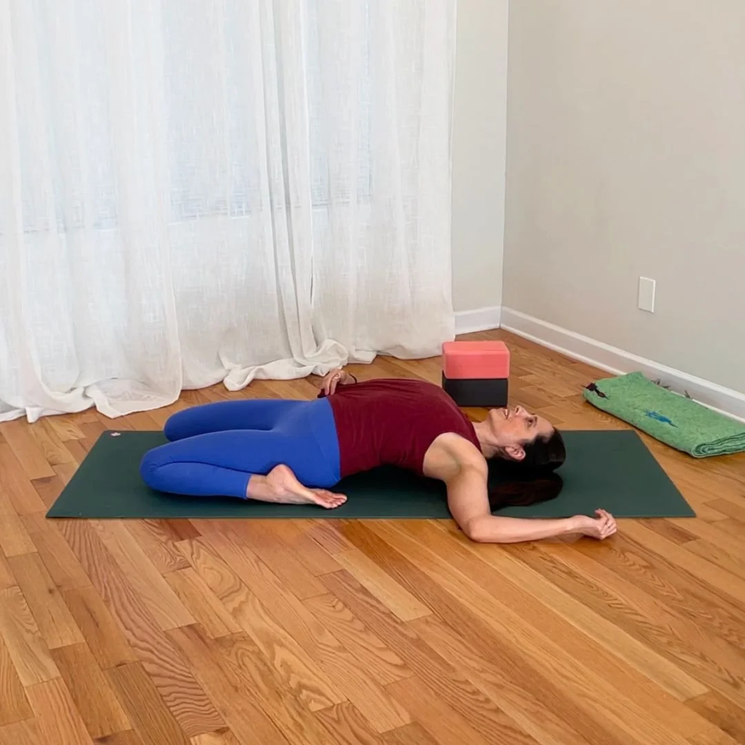 Supta virasana variation with increased lumbar spine extension