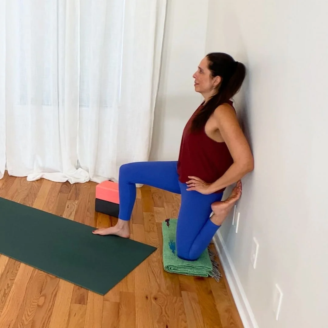 Couch stretch at wall with back knee bent and hip extended