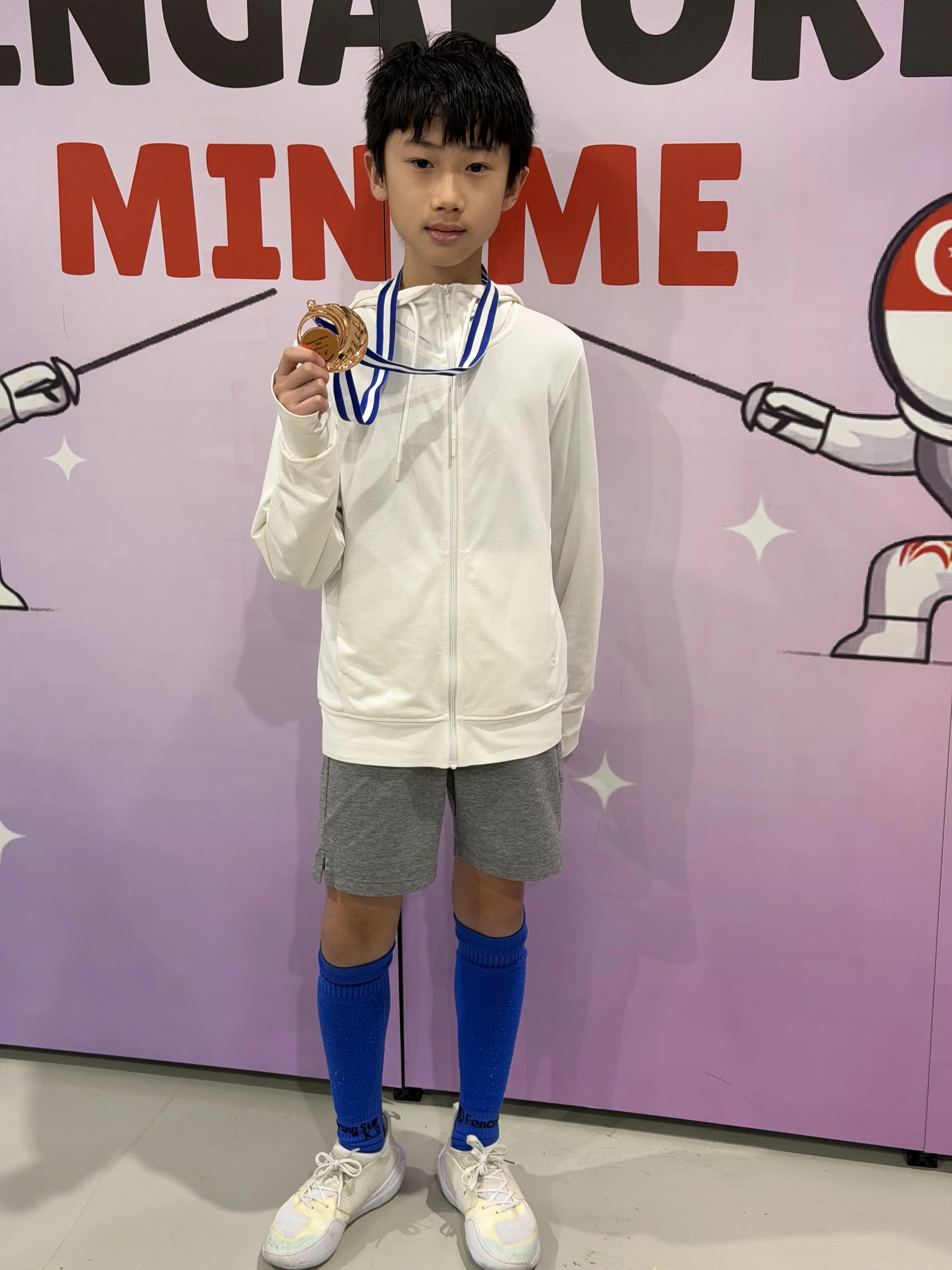 Liau Clayton - 8th in individual U12 Men’s foil.jpeg