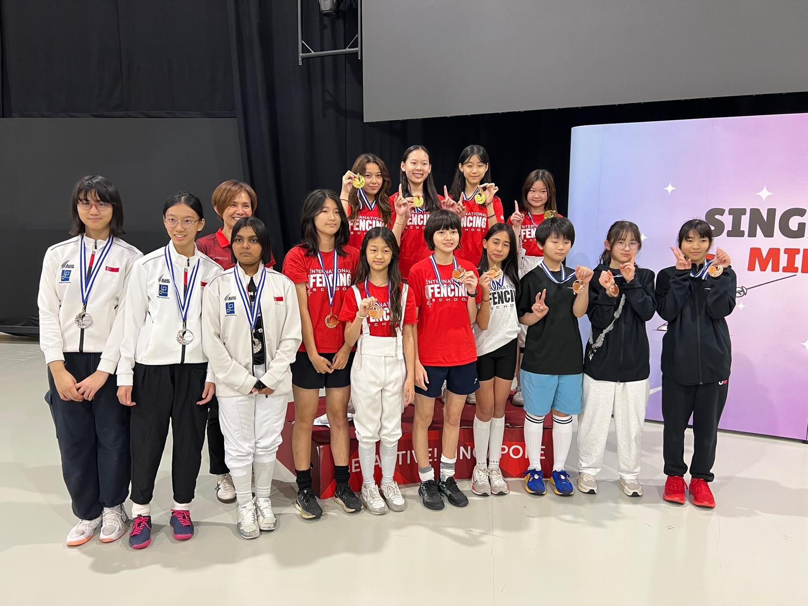 Gold and Bronze in Teams U14 Women's epee (2).jpg