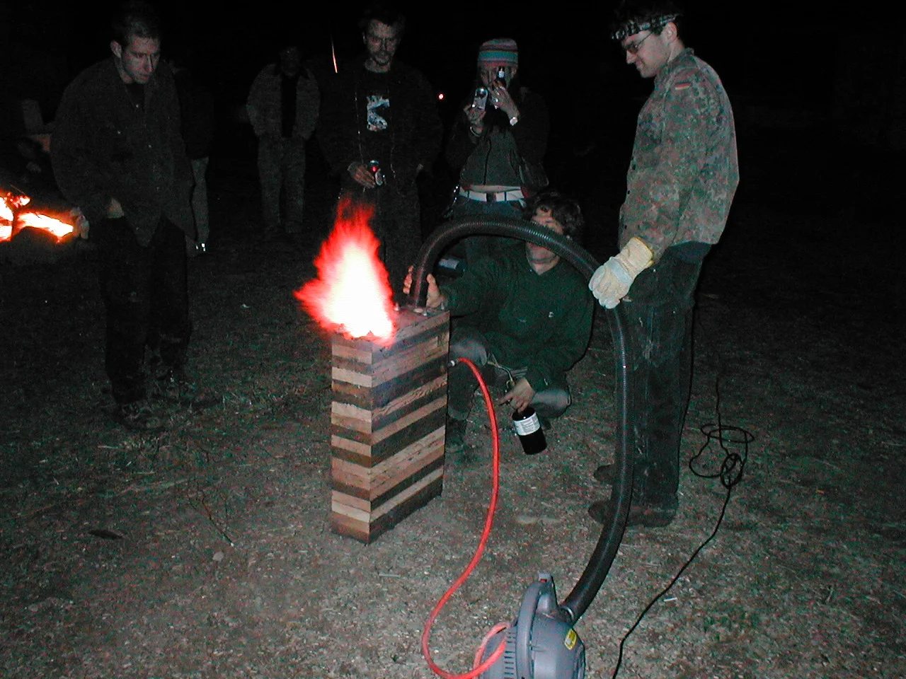 Starting the pulse jet with forced air black hose. Orange hose is propane feed. 