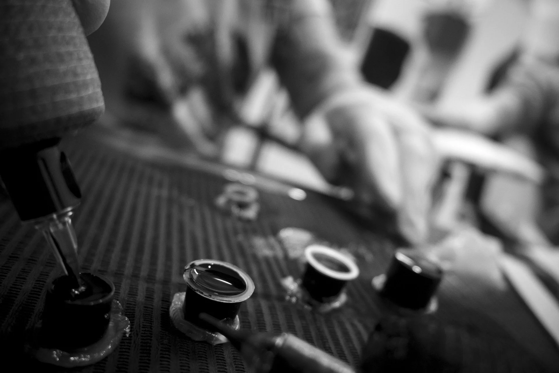 Tattoo ink caps prepared for a custom tattoo session by Daniele Tonelli in Rome, Italy.