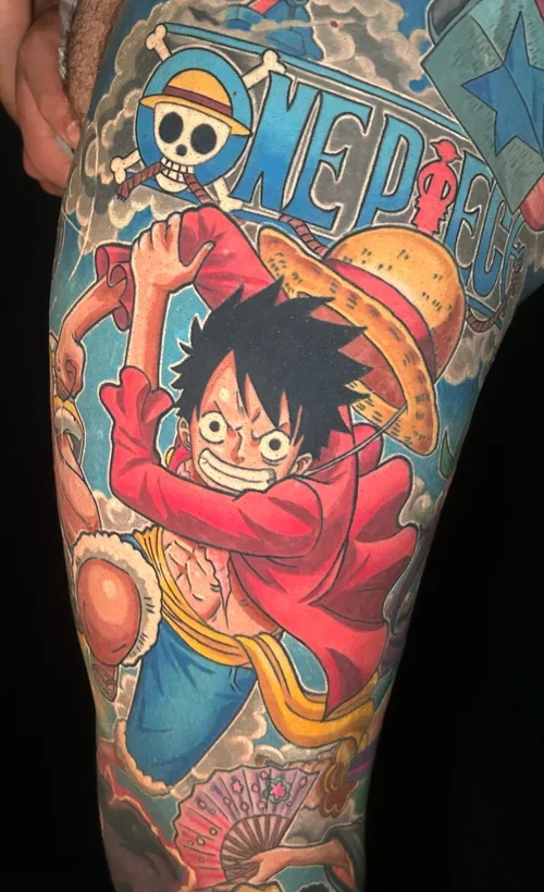 Color tattoo of Luffy from One Piece on the thigh by Daniele Tonelli.