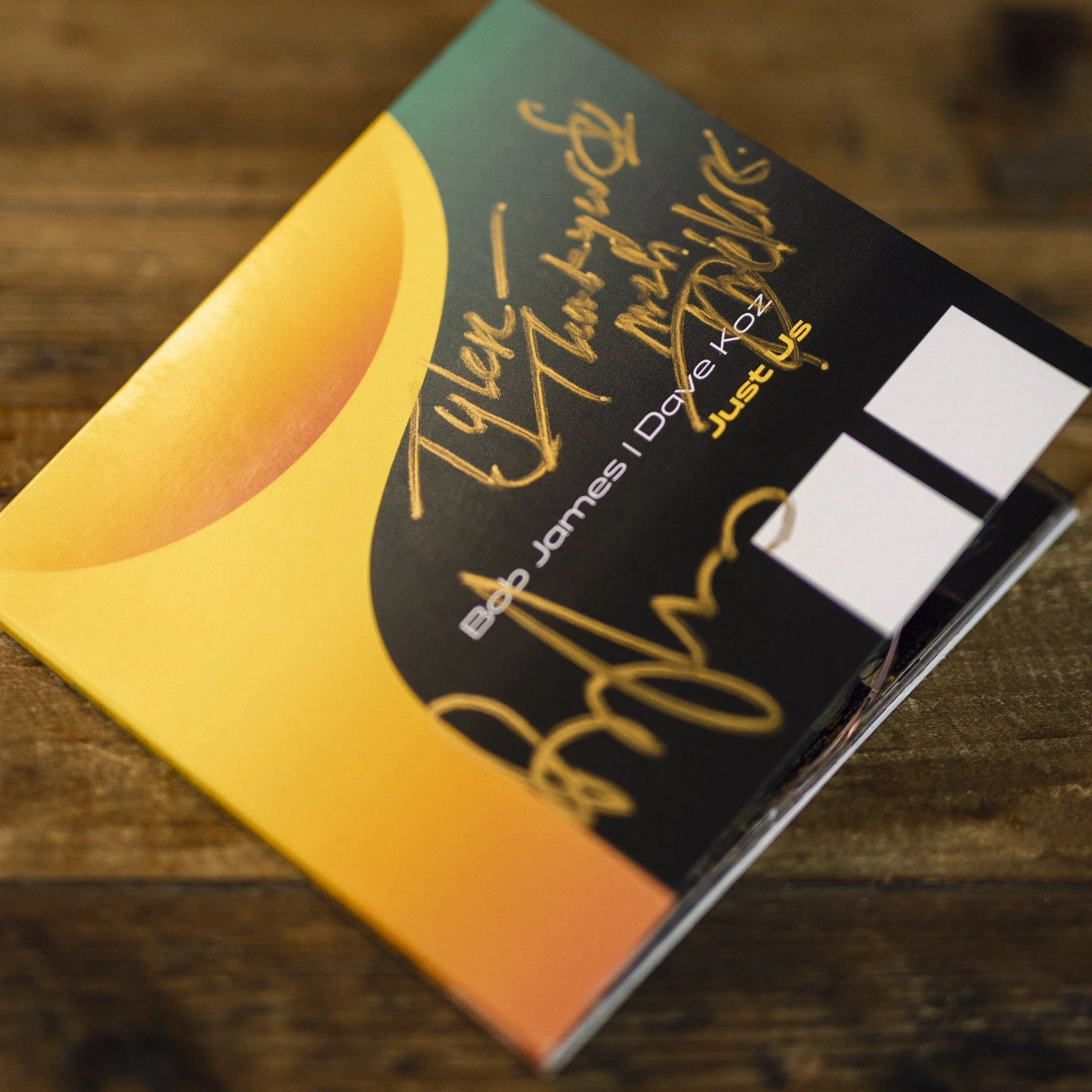 Book cover with sunset illustration and handwritten-style gold text.