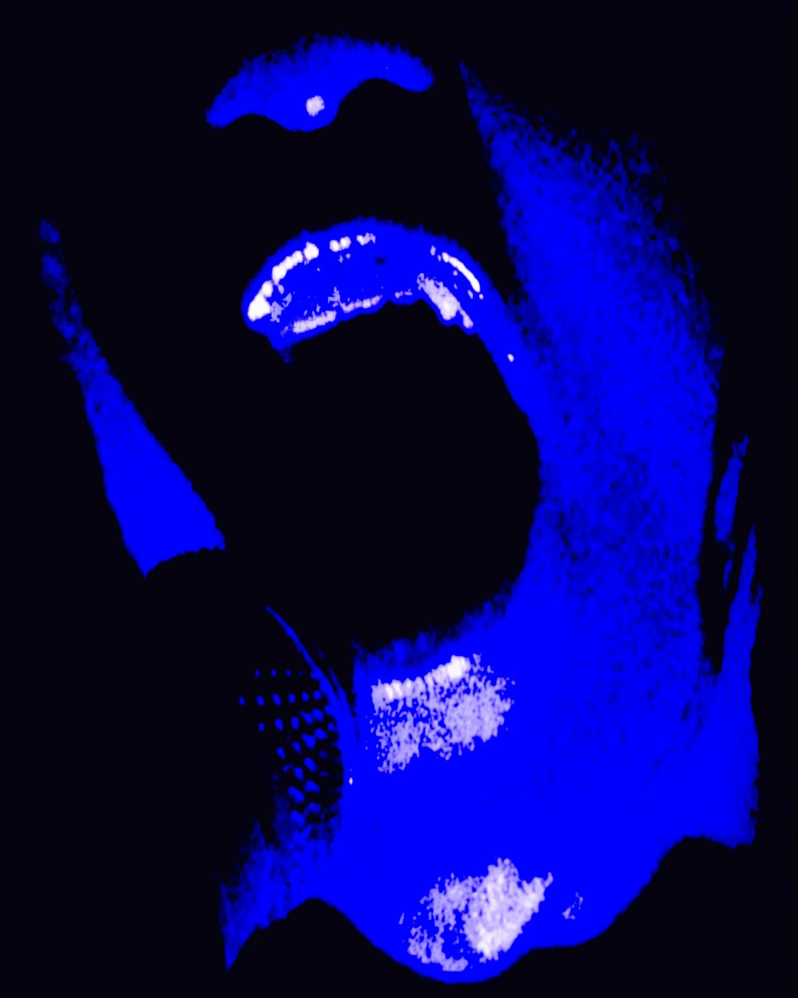 Close-up of a person singing into a microphone in darkness, illuminated by blue neon lights.