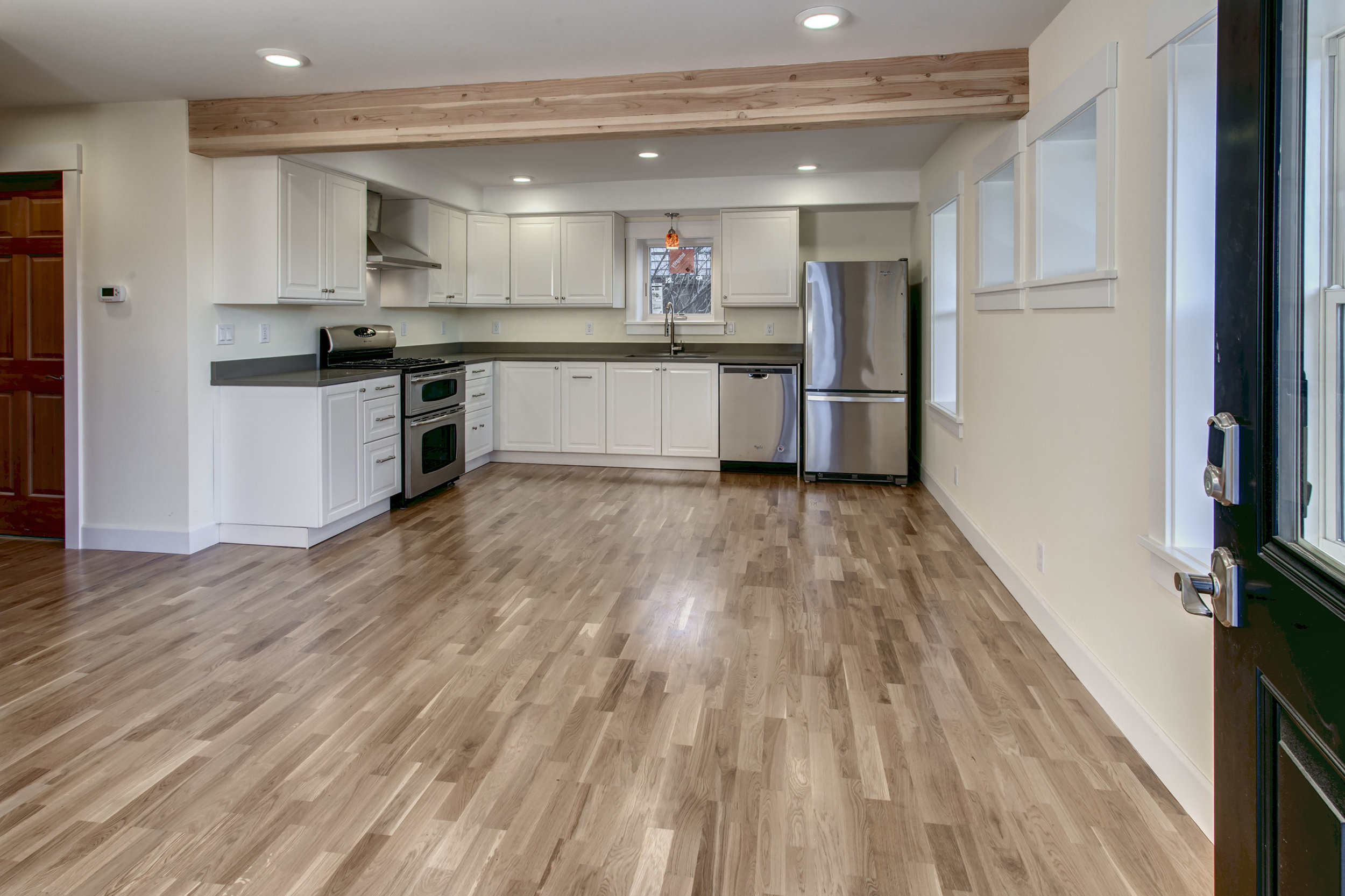 Spacious living room and kitchen greets you at the front door. 