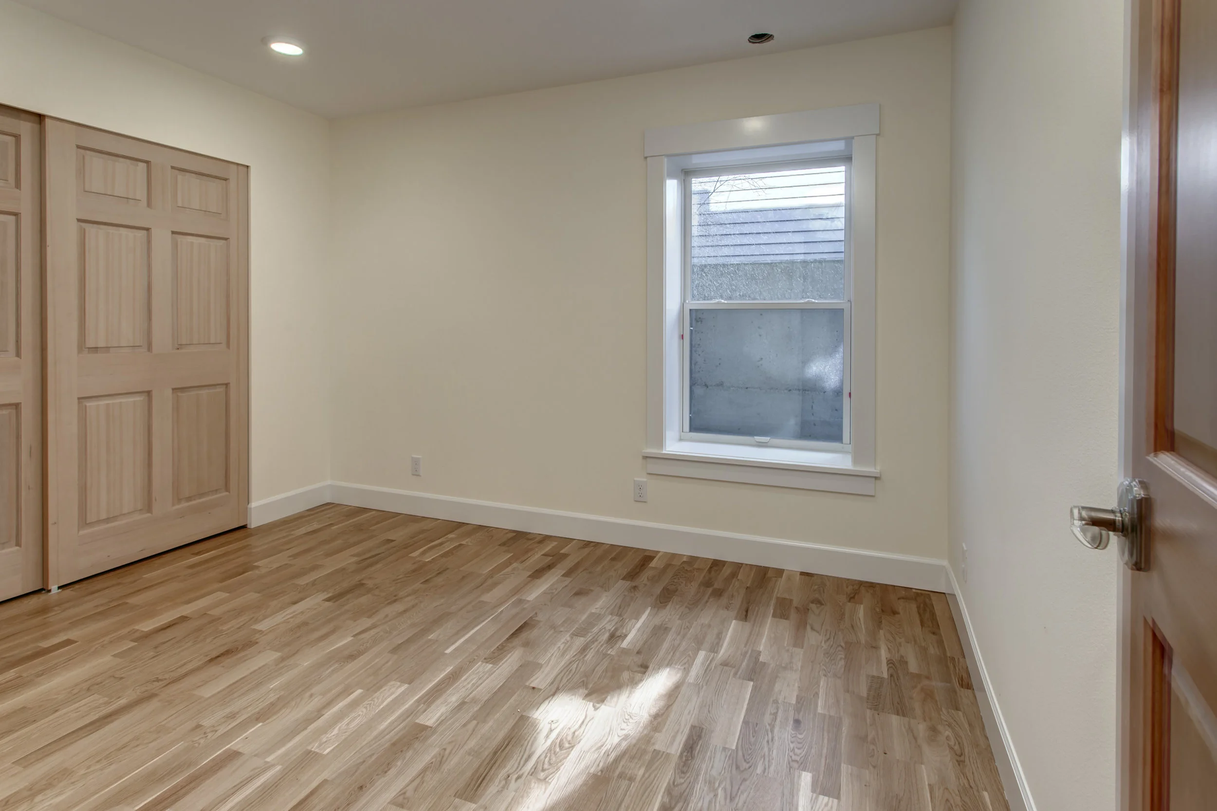 A giant bedroom with a huge window. Not pictured a separate laundry closet! 
