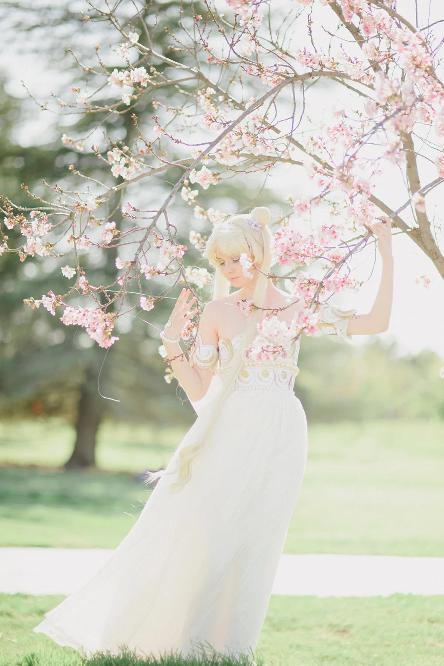 'Sailor Moon' has been one of my biggest influences growing up. The series taught me to believe in myself and to love deeply. Whenever I was afraid I would imagine that I was a Sailor Scout with magical powers! So it is no surprise that I have dreamed of making Princess Serenity's gown. I was so deeply inspired by the Dior gown that Naoko Takeuchi drew inspiration from, and thusly I wanted to create a hybrid of Takeuchi's and Dior's concepts. I knew that my childhood friend Laura (who loves the series like I do) would be the perfect model for this design, and that Emma Rolos of Honey Honey Photography was the woman to photograph this gown. I enlisted the help of hair stylist Chloe Doan for the wig and was fortunate to work with one of my favorite makeup artists Megan Joy . I hope that this shoot enchants you as much as it does me, and that it brings you back to the etheric beauty of the Moon Kingdom. All photos © Creature of Habit and Honey Honey Photography do not use without permission