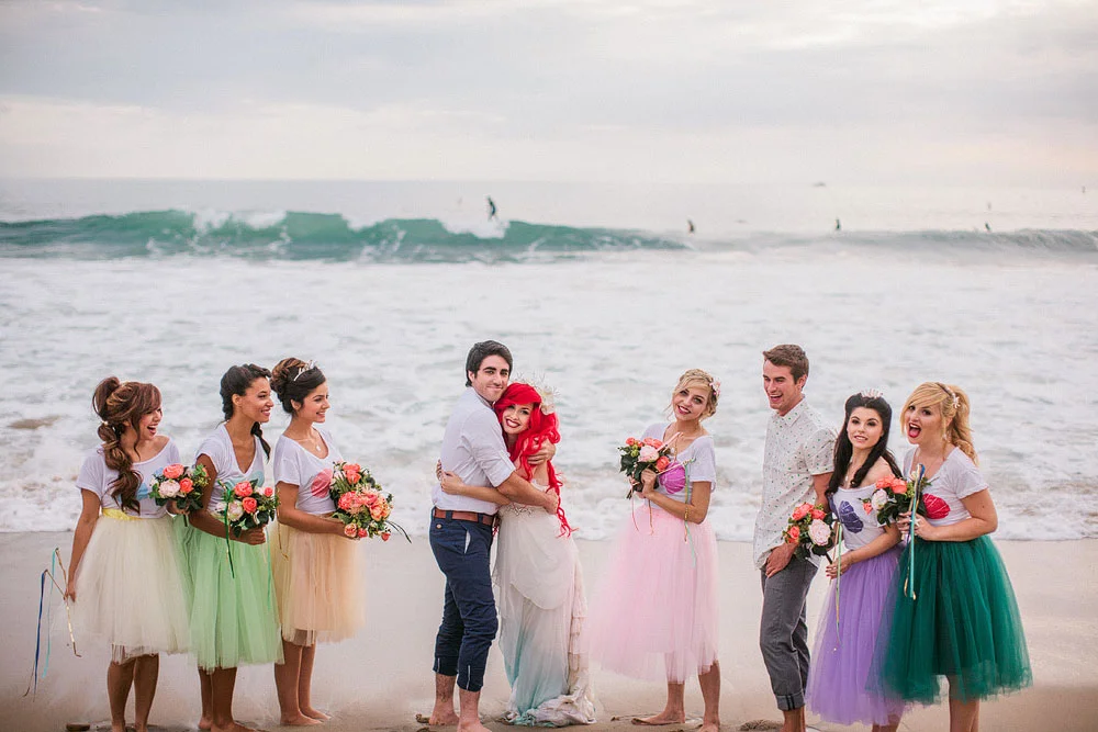 I had the honor of being a contributing vendor and model for Your Cloud Parade 's "Little Mermaid"-inspired Mer Wedding shoot! So many talented people and designers came together to create this magical Disney lover's dream! I created custom headpieces for the bride and bridesmaids - all of which can be purchased exclusively in my Cloud Parade shop . This editorial has been featured on PopSugar , Huffington Post , Cosmopolitan , Disney's style blog among many others. Photographer - Mark Brooke Photography / Mathieu Photography Hair accessories - Creature of Habit Bride model - Traci Hines / Groom model - Leo Camacho Bridesmaid models - CharismaStar , Brytni Jean , Vanessa Elaine , Helena Levin, Joanna Bert , Amber Arden Hair and makeup - 1011 Makeup Wedding gown - Claire la Faye Shell print crop tops - Adorkable Apparel Bridesmaids skirts: tutus - Dark Pony Designs Wedding stylist - Lauren Grey Florist - A Blooming Bud