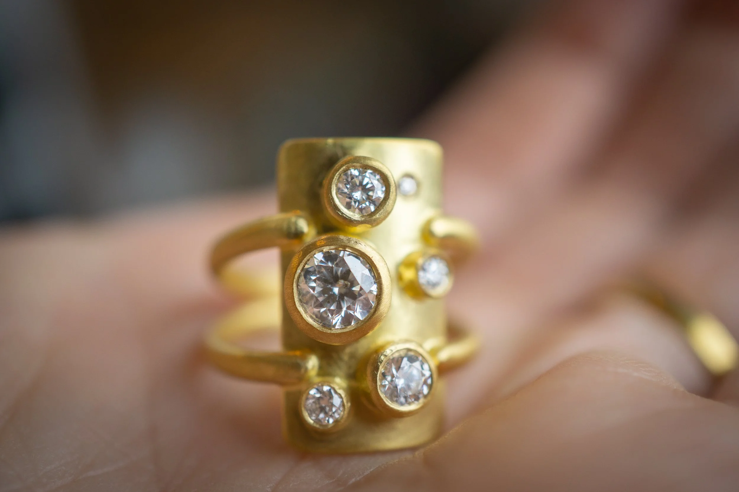 Shield of Nyx Ring front view, in palm of hand.