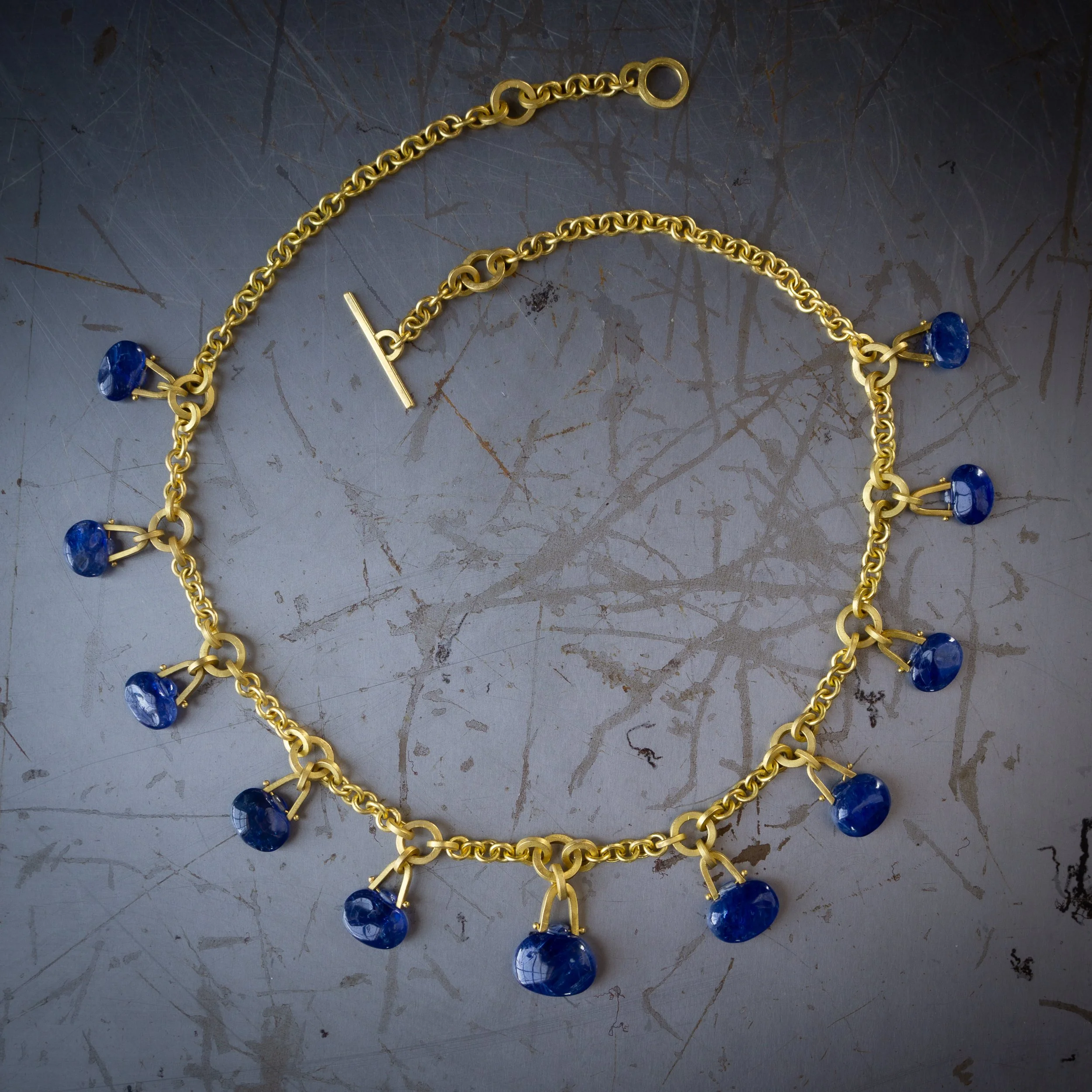 Tabiz Necklace in high karat gold and sapphires.