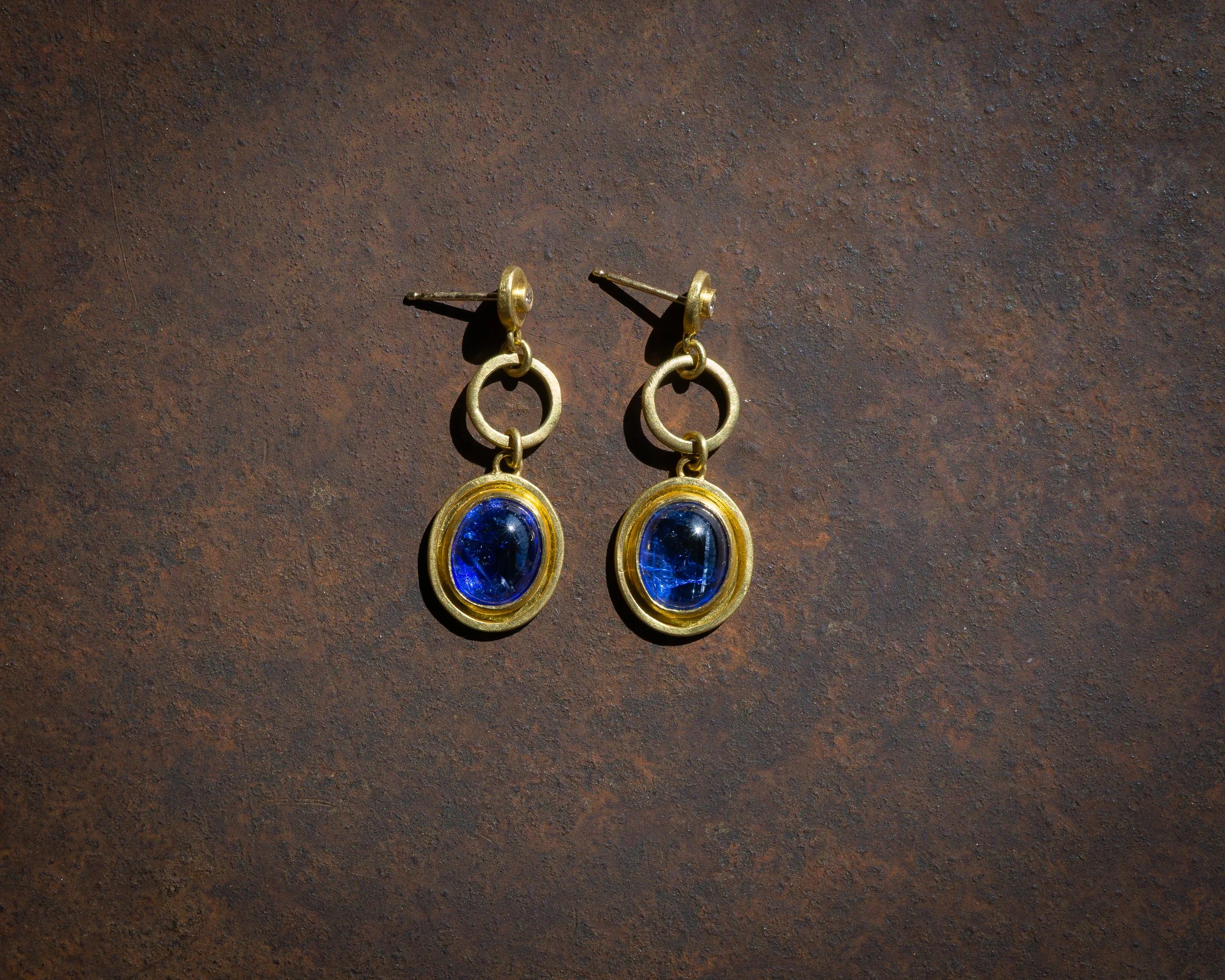 Halo Earrings with Tanzanite, in 22k gold, diamond studs.