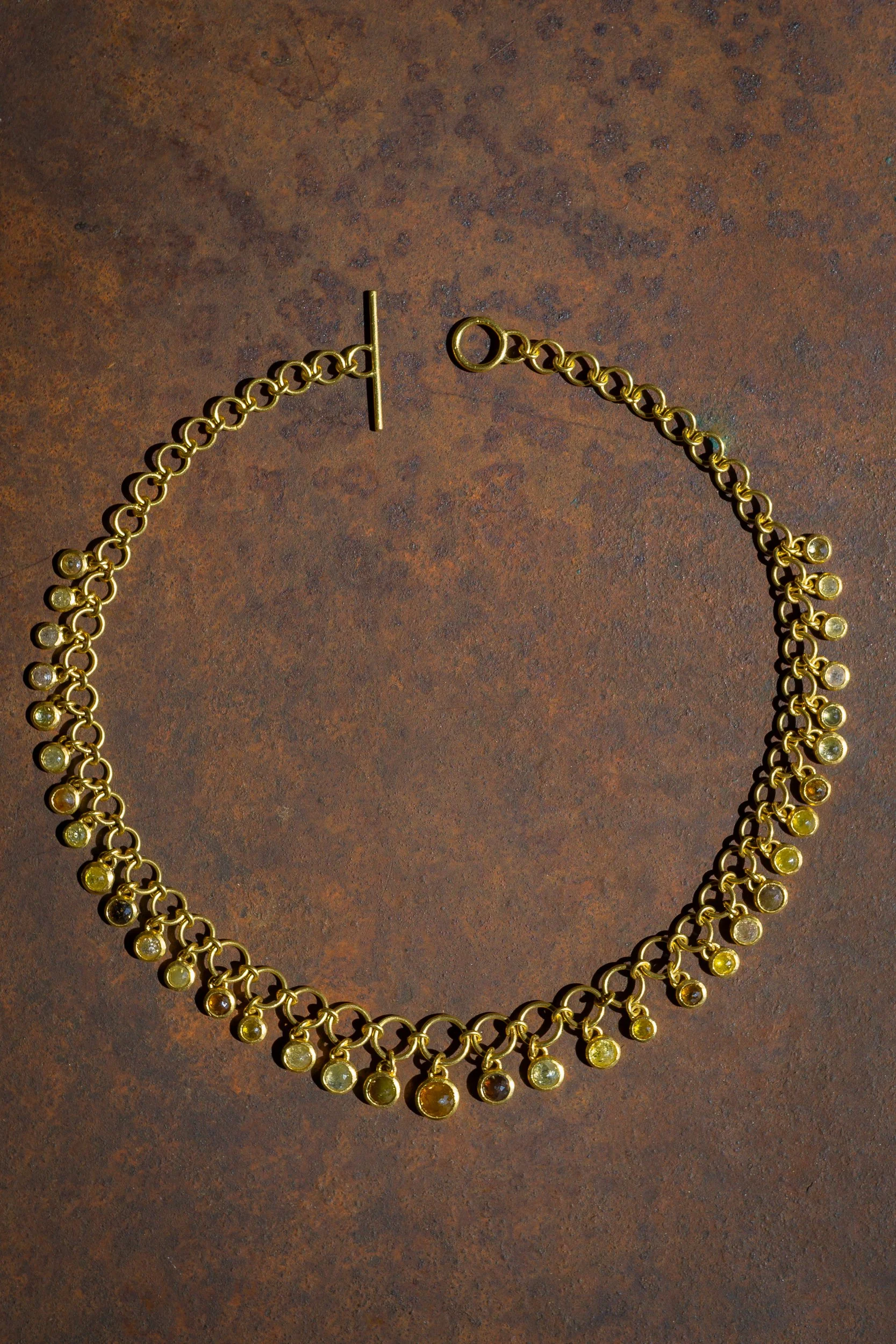 Dawn Necklace in 22k gold and fancy colored rustic diamonds.