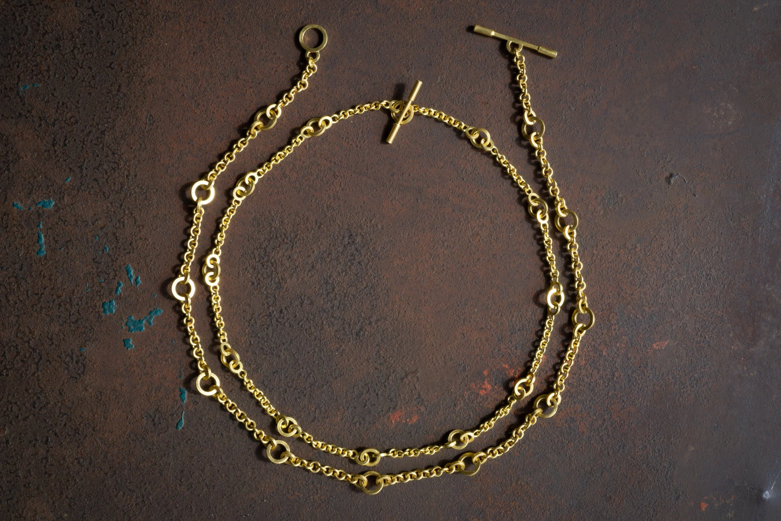 Triadic Chain, shown in two dimensions, full view of both on tabletop.
