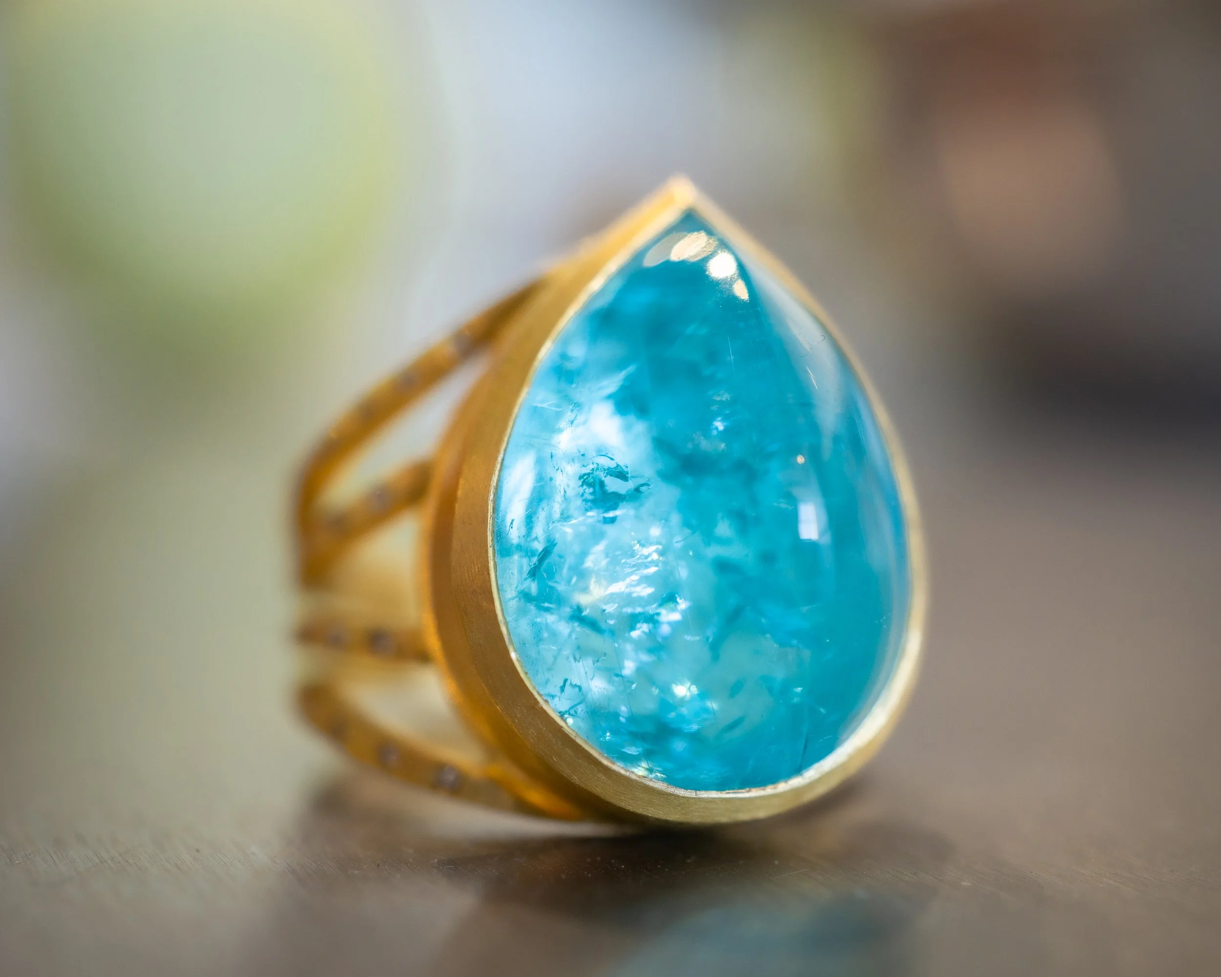 Juno Ring in 22k gold, paraiba tourmaline, Mozambique, and diamonds.