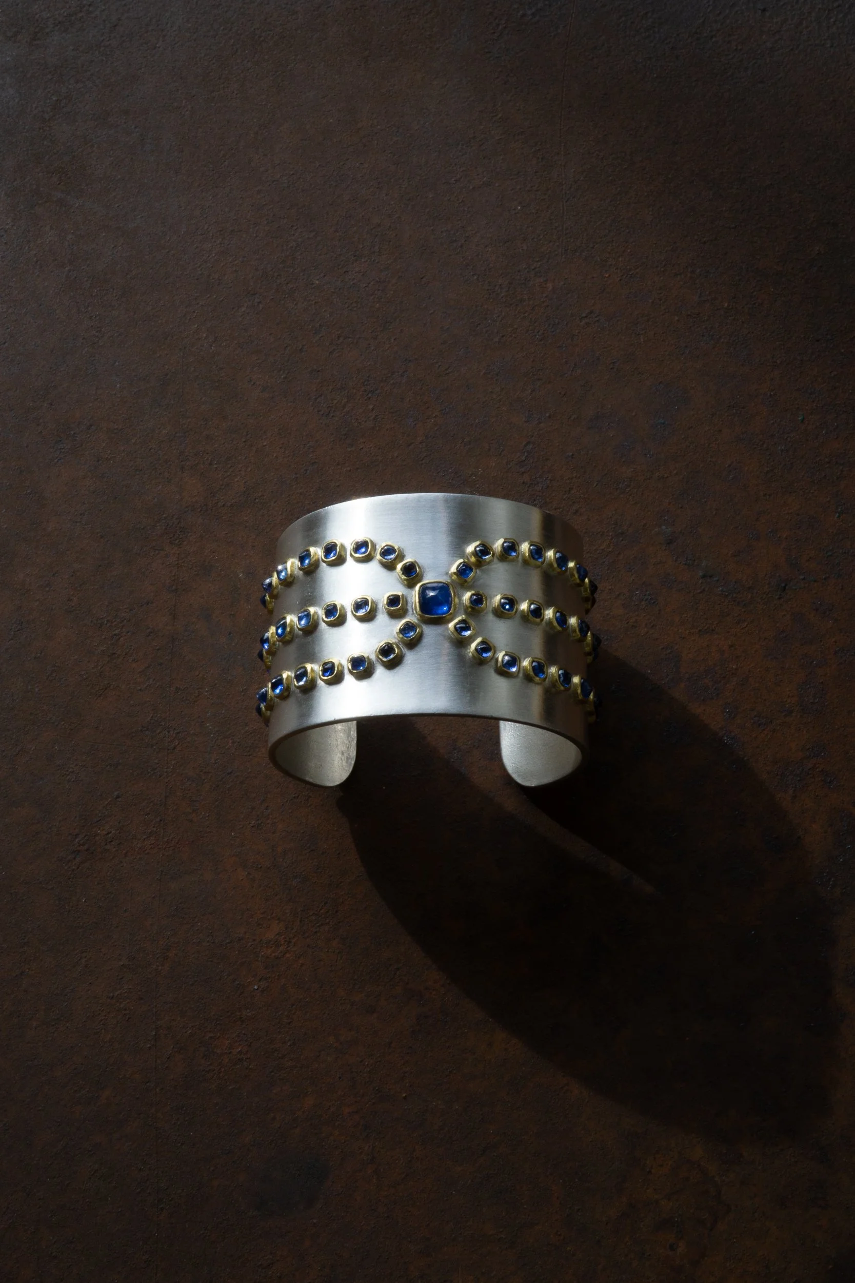 Alcyone Cuff in 22k and fine silver with Ceylon sapphire sugarloaf cabochons.