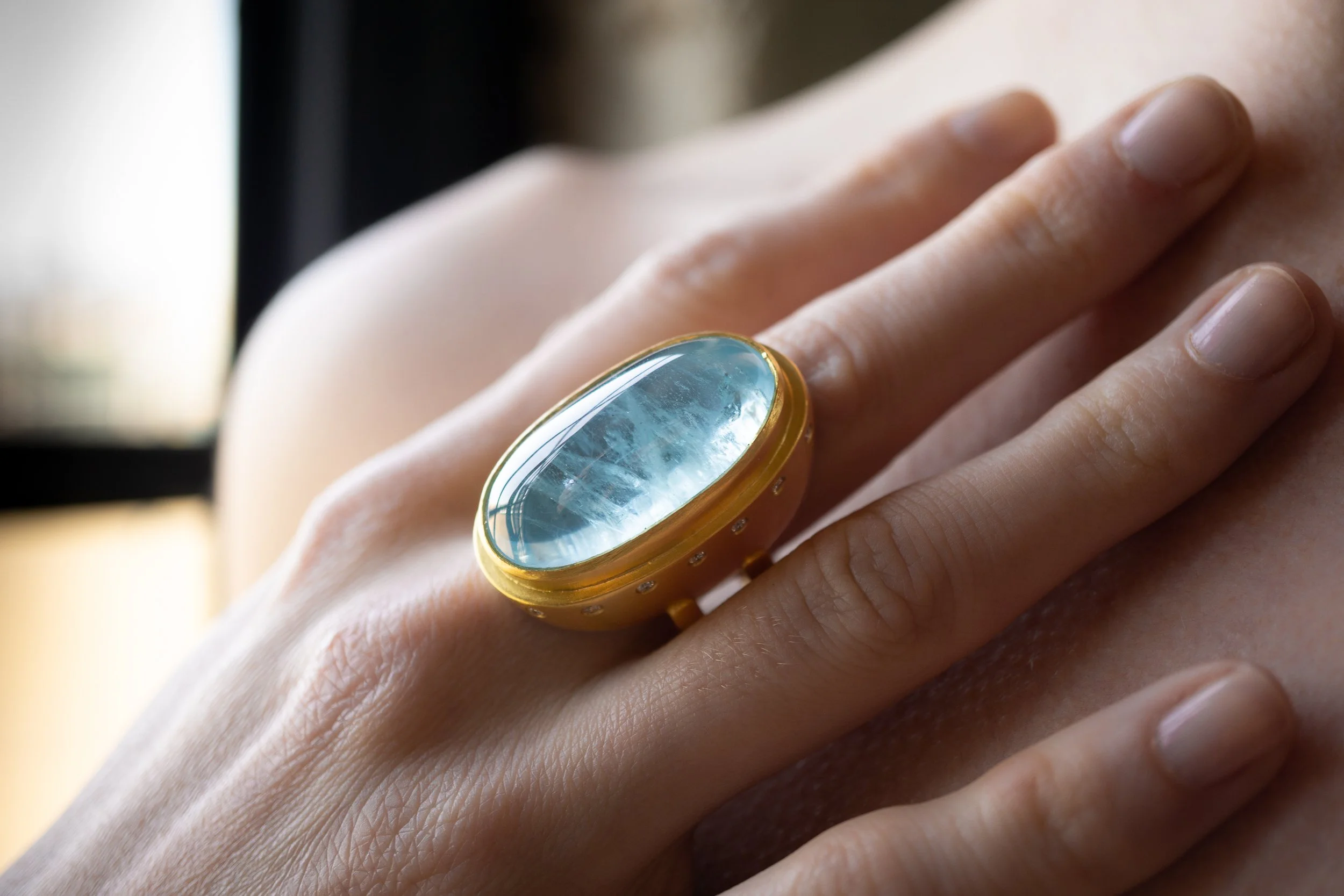Galene Ring on a finger, close up.