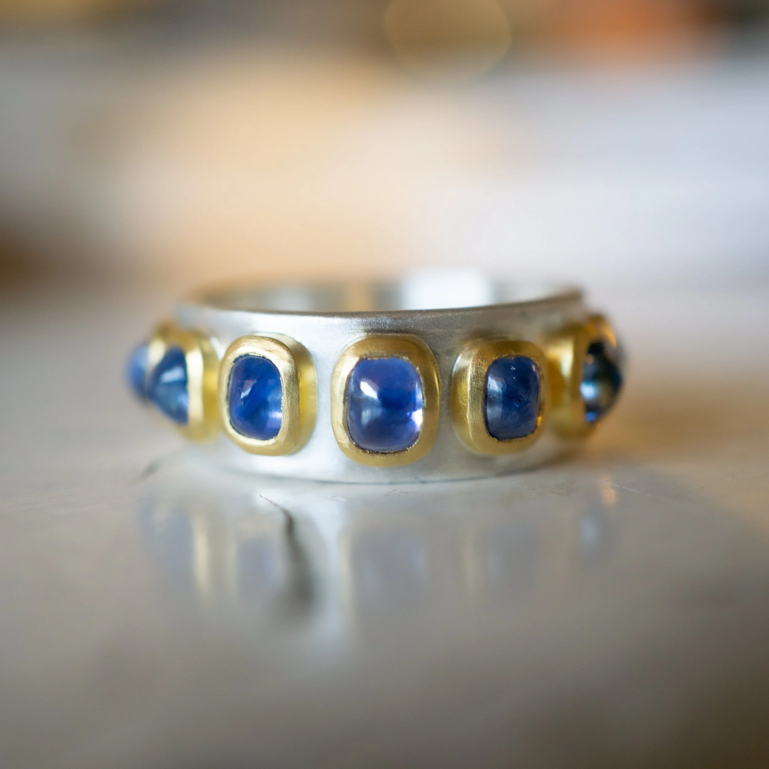 Pleiades Ring in 22k and fine silver, with sapphire.