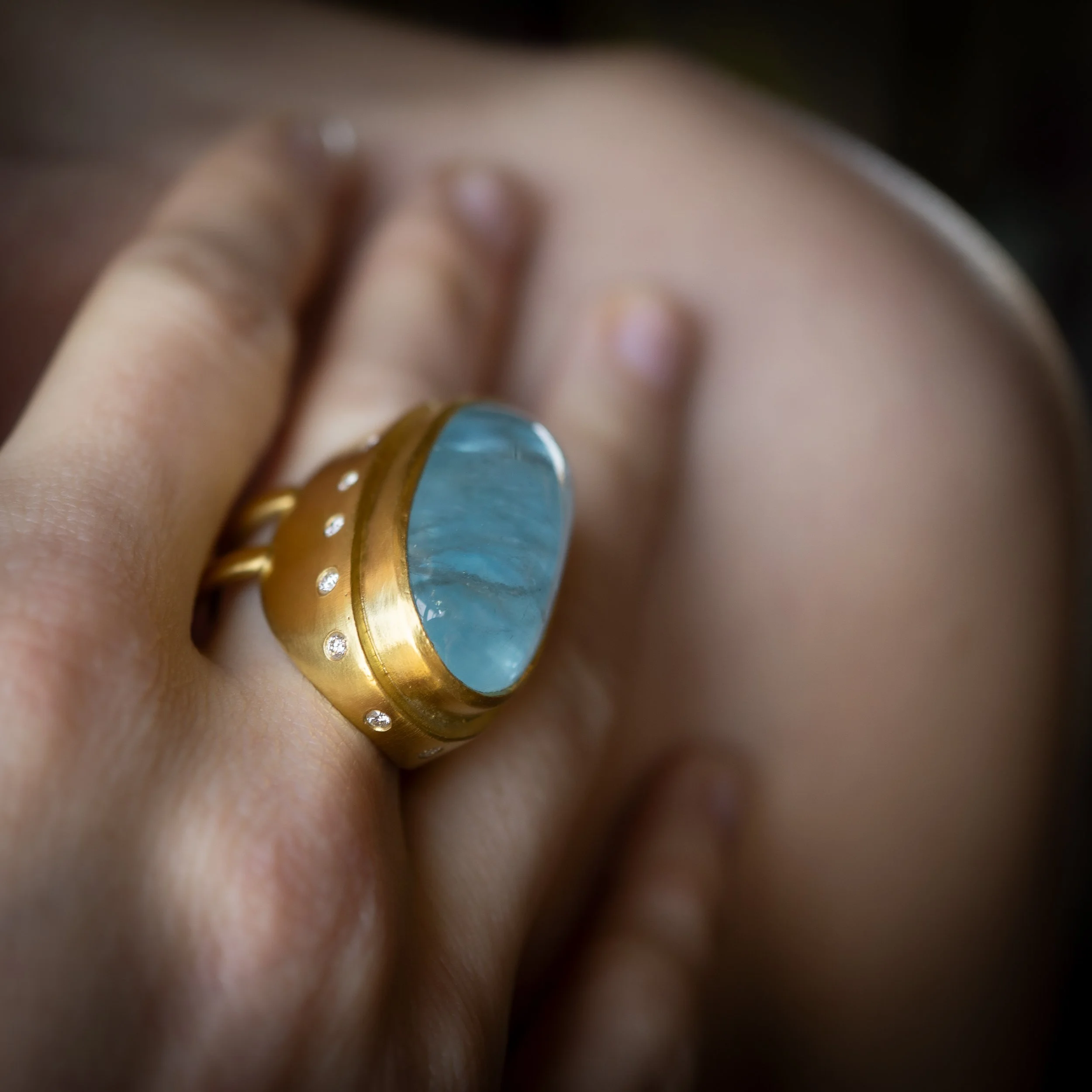 Galene Ring worn on the hand, macro end view.