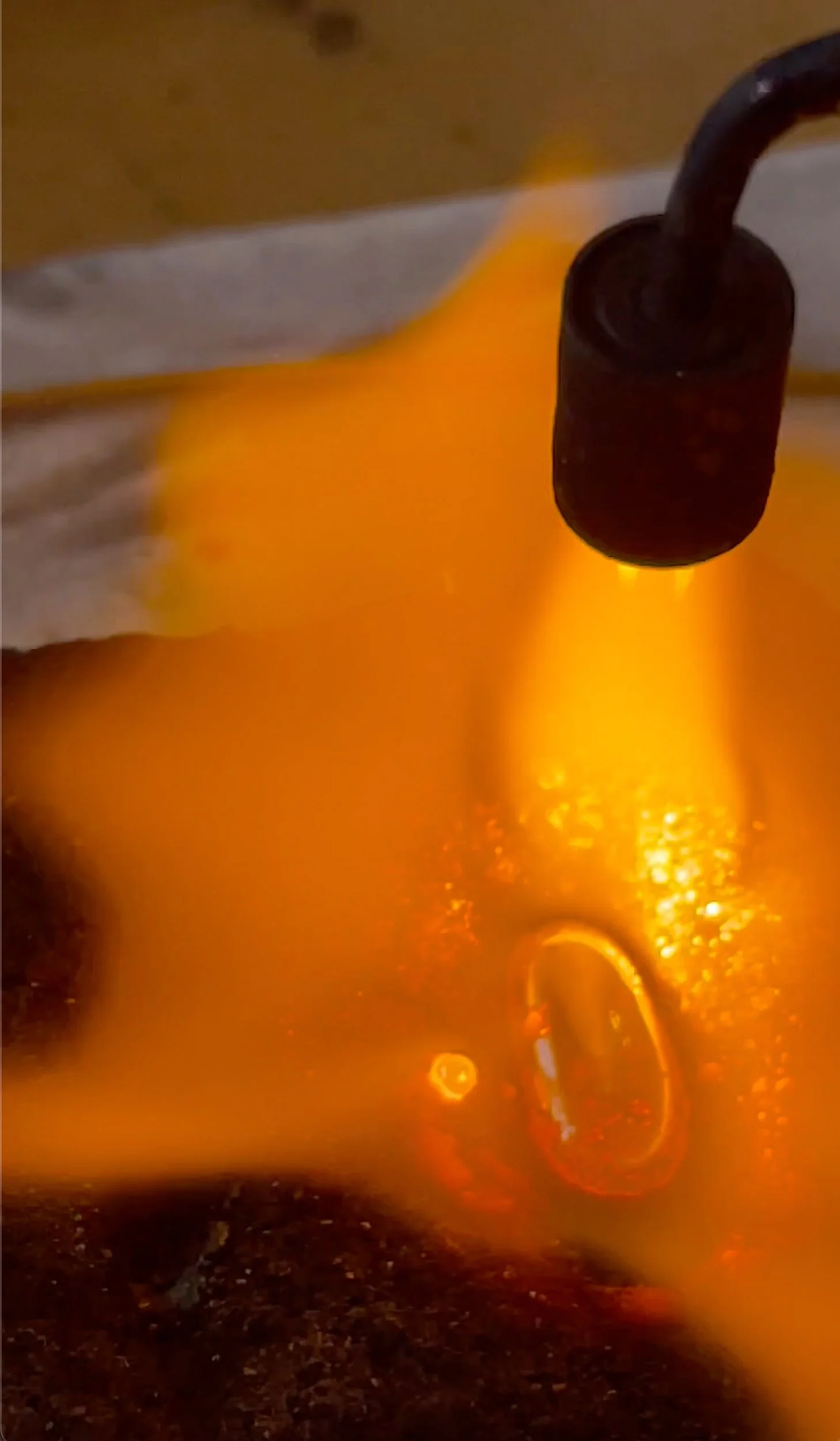 Torch melting gold.