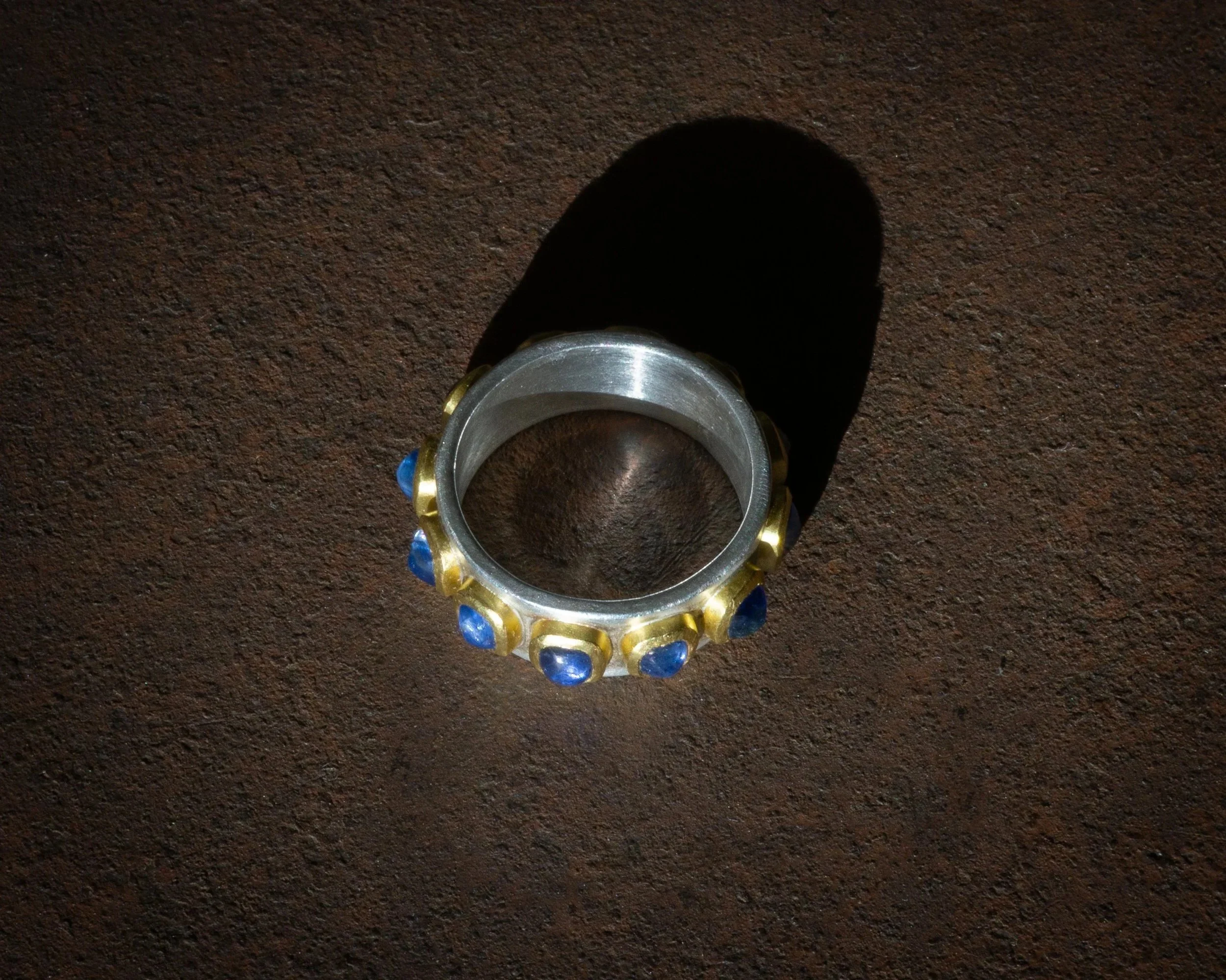 Pleiades Ring in 22 karat gold, fine silver, and Ceylon sapphires.