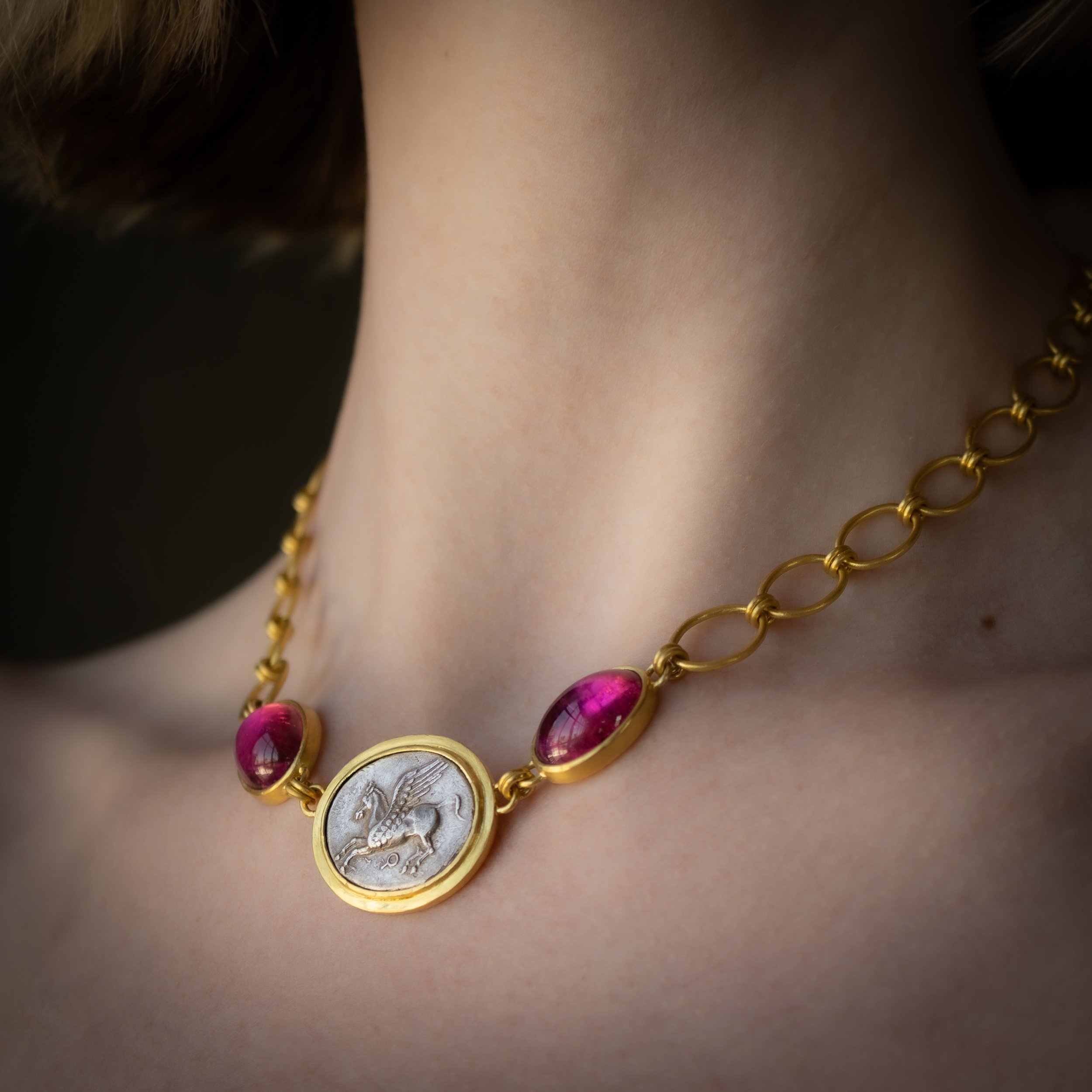 Pegasus Necklace shown on the body.