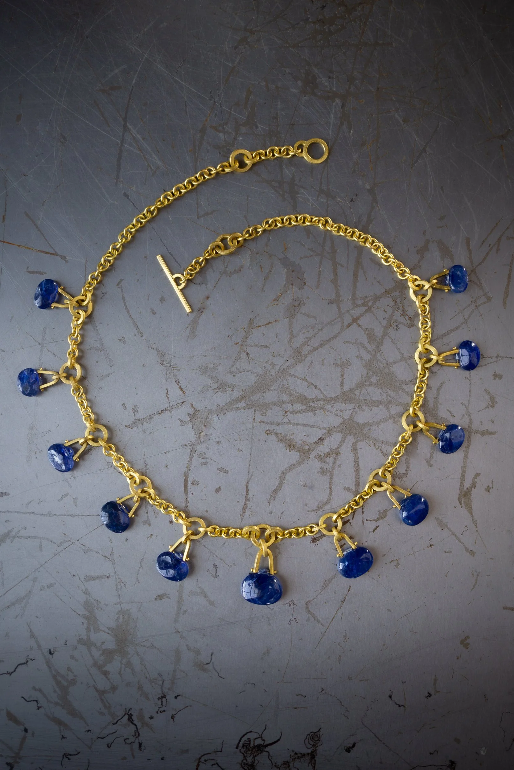 Tabiz Necklace in 22k gold and sapphire.