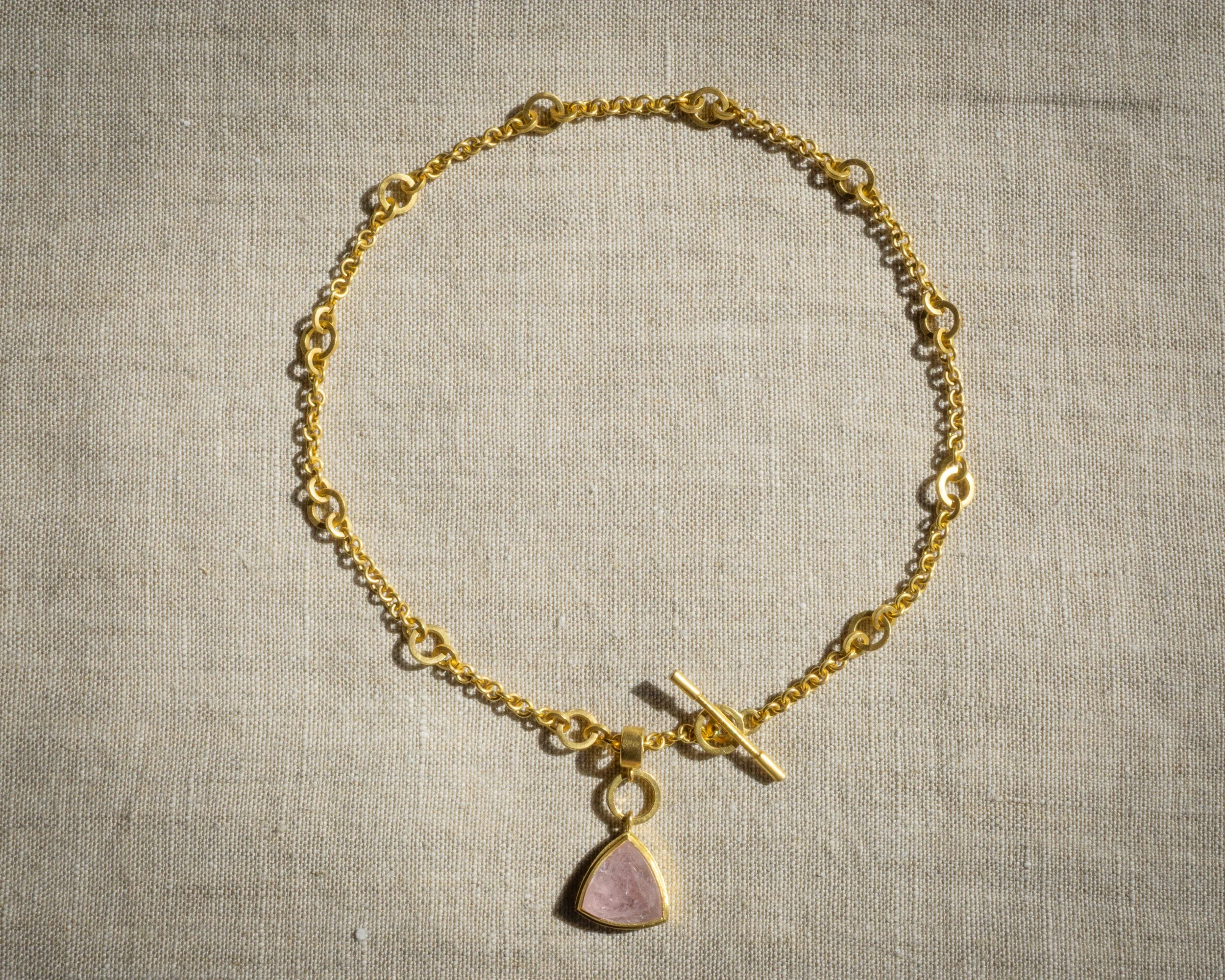 Halo Charm with Morganite shown on a necklace.