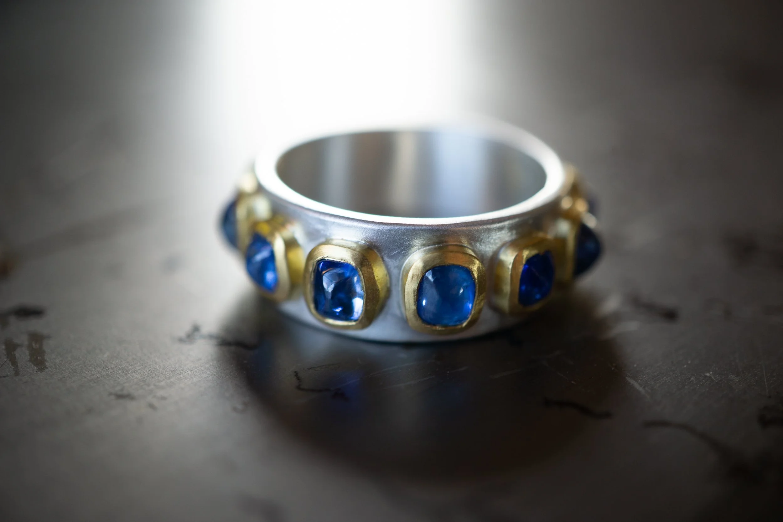 Pleiades Ring in 22 karat gold, fine silver, and Ceylon sapphires.